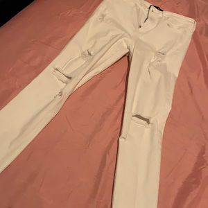 White hollister jean with rips in them
